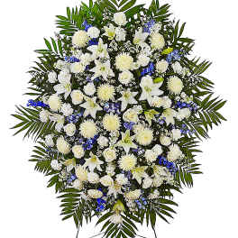 Large white and blue funeral spray with lilies and roses