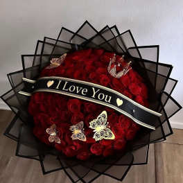 Large bouquet of red roses with a black "I Love You" ribbon