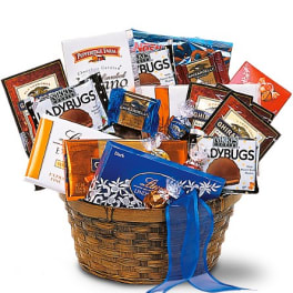 Basket of assorted chocolate bars and candy packages with a blue ribbon