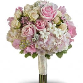 Pink and cream rose bouquet with hydrangea and small white flowers