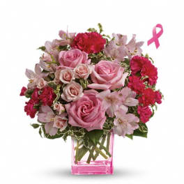Pink roses and carnations in a pink glass vase with a ribbon icon