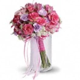 Pink and lavender bouquet with ribbon tied around the stems