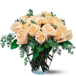Bouquet of peach roses in a clear glass vase