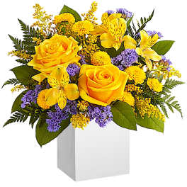 Yellow roses and alstroemeria in a white box vase