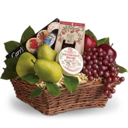 Gift basket with pears, grapes, cheese, and crackers in a wicker basket