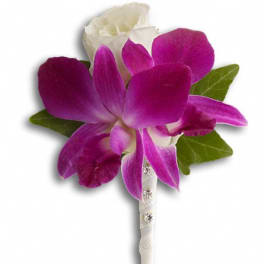 Purple and white orchid boutonniere with green leaves