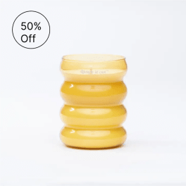 Yellow ribbed glass candle holder with a 50% off badge