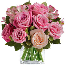 Pink roses and alstroemeria in a clear glass vase