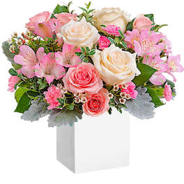 Pink and white rose bouquet in a white box vase