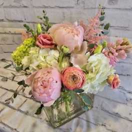 Pink and white mixed bouquet in a clear glass vase