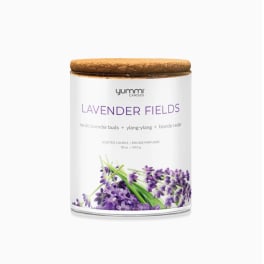 Lavender scented candle in a glass jar with a wooden lid