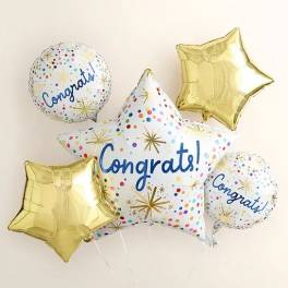 Cluster of congratulatory star-shaped and round balloons