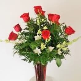 Deluxe Long Stem Red Roses arranged in a vase