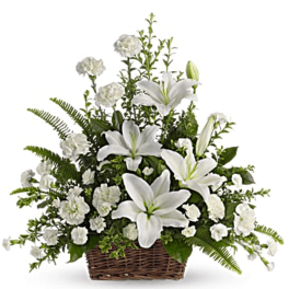 White lilies and carnations in a wicker basket