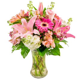 Pink and white mixed bouquet in a clear glass vase