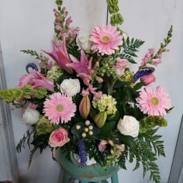 Pink and white mixed flower arrangement in a vase