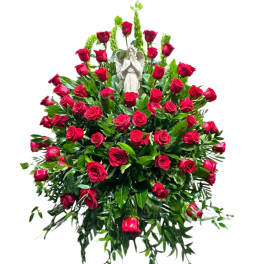 Red rose standing spray with an angel statue in the center