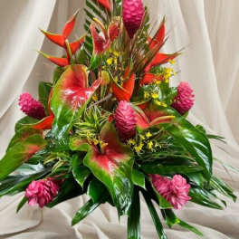 Tropical bouquet with red heliconia and pink ginger flowers