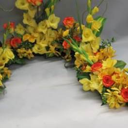 Yellow and red floral garland arranged in a curved shape