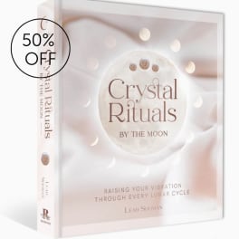 A boxed book titled Crystal Rituals with a 50% off sticker