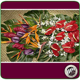 Tropical floral arrangement with red anthuriums and bird-of-paradise blooms