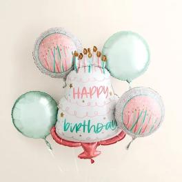 Birthday balloon bouquet with a cake-shaped centerpiece and pastel round balloons