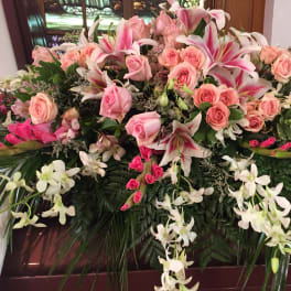 Large floral spray with pink roses and white lilies