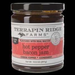 Jar of hot pepper bacon jam with a black lid