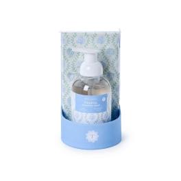 Foaming soap bottle in a blue gift box with patterned wrapping