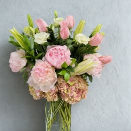 Pink and white bouquet in a clear glass vase