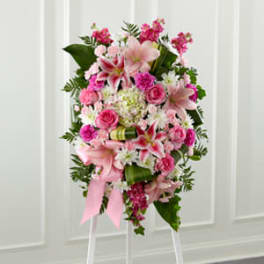 Pink and white floral standing spray on an easel