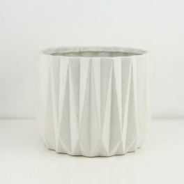 White faceted ceramic planter pot on a plain background