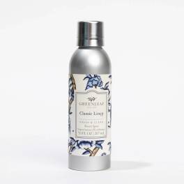 Silver room spray bottle with a floral label