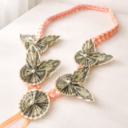 Money lei with delicate dollar flowers