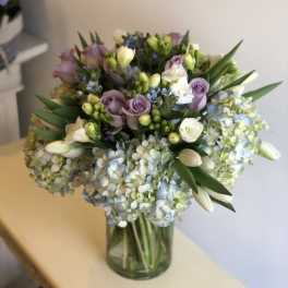 Bouquet of pastel flowers in a glass vase