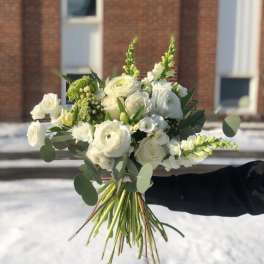 White bouquet with round blooms and green accents