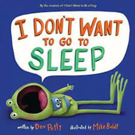 Children's book cover with a green frog and large text saying I DON'T WANT TO GO TO SLEEP