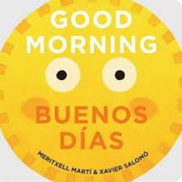 Round yellow sign with a smiling face and the words Good Morning Buenos Días