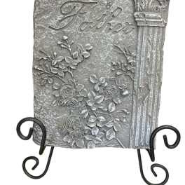 Decorative stone plaque reading "Loving Father" with floral relief