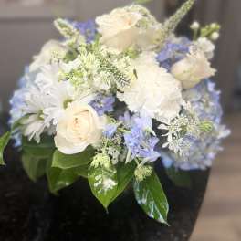 Bouquet of white roses, daisies, and blue flowers