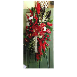 Tall red floral standing spray on an easel