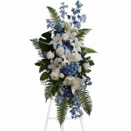 Tall white and blue floral standing spray with fern accents