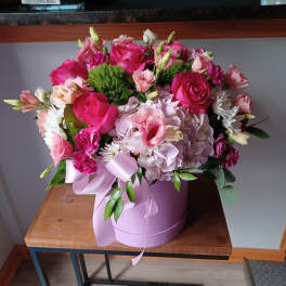 Pink and white mixed bouquet in a lavender hatbox with ribbon