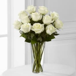 Bouquet of white roses in a clear glass vase