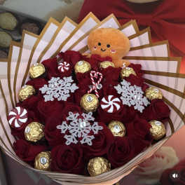 Bouquet of red roses with chocolates and a small plush toy