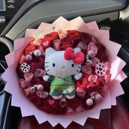 Bouquet of red and pink roses with a Hello Kitty plush in the center