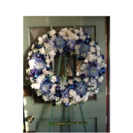 Blue and white floral wreath on a door