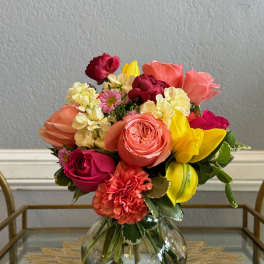 Colorful mixed bouquet in a clear glass vase