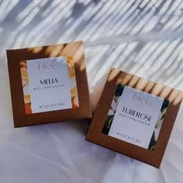 Two boxed body and hand soap bars labeled Melia and Tuberose