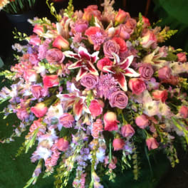 Large pink and lavender floral spray with roses and lilies